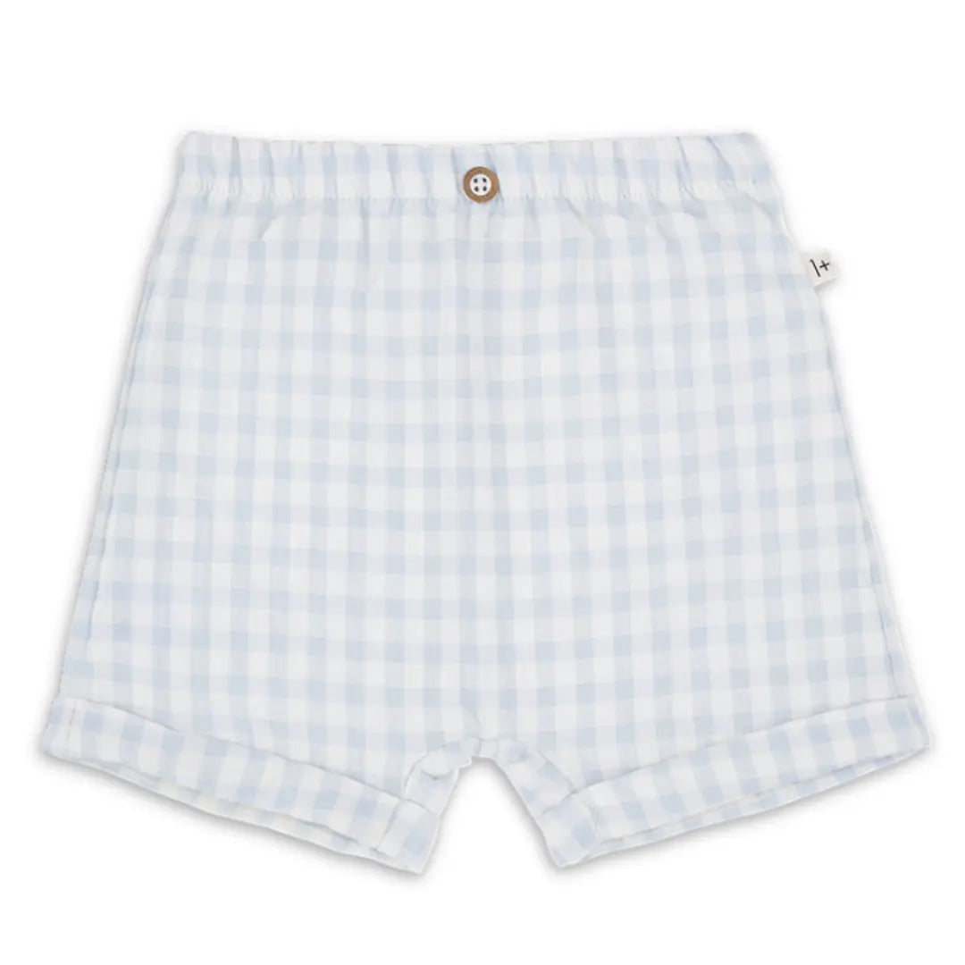 A pair of minimalist 1+ in the Family Bermuda Shorts in Misty Blue, showcasing the refined architectural tailoring and premium fabric texture.