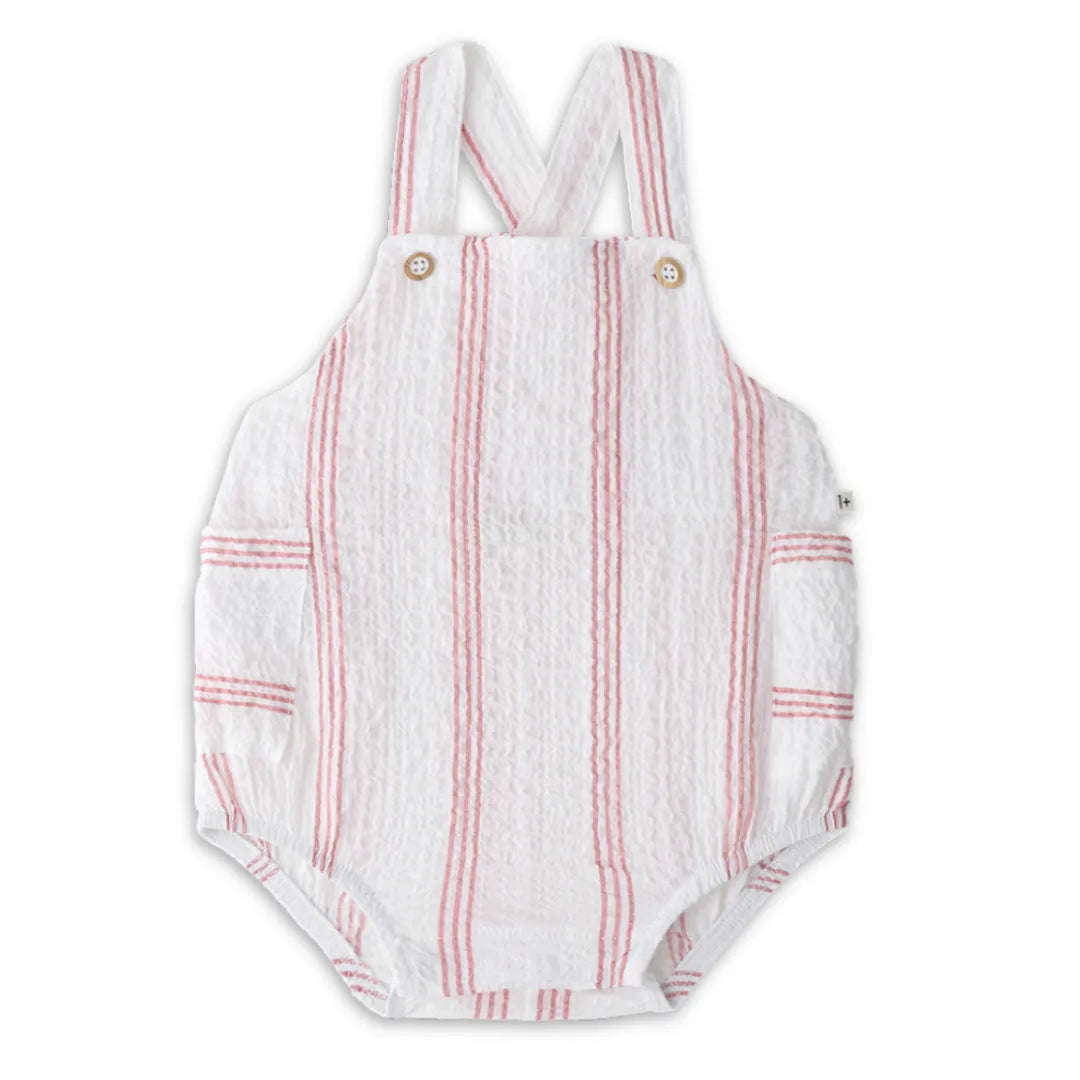 A high-end 1+ in the Family Portitxol Romper in a soft neutral textured knit, showcasing the modern architectural drape and minimalist boutique finish.