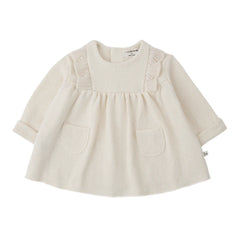 A soft, flowy 1+ in the Family TALENCE dress for babies and toddlers in a natural ecru color.