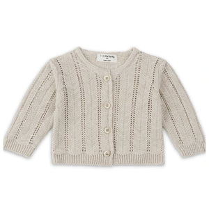A sophisticated 1+ in the Family Xelida Jacket in a muted beige tone, showcasing its structured silhouette and high-end boutique finish.