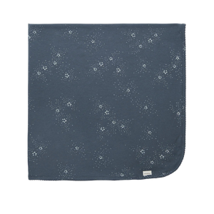 Navy blue fabric with white floral pattern on a white background