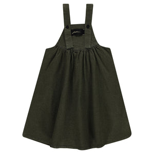 Green pinafore dress on a white background