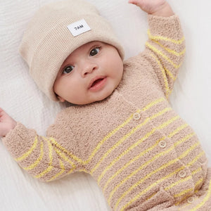 A child wearing the 7AM Enfant beanie comfortably