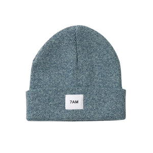 A flat-lay view of the 7AM Enfant beanie in aqua.