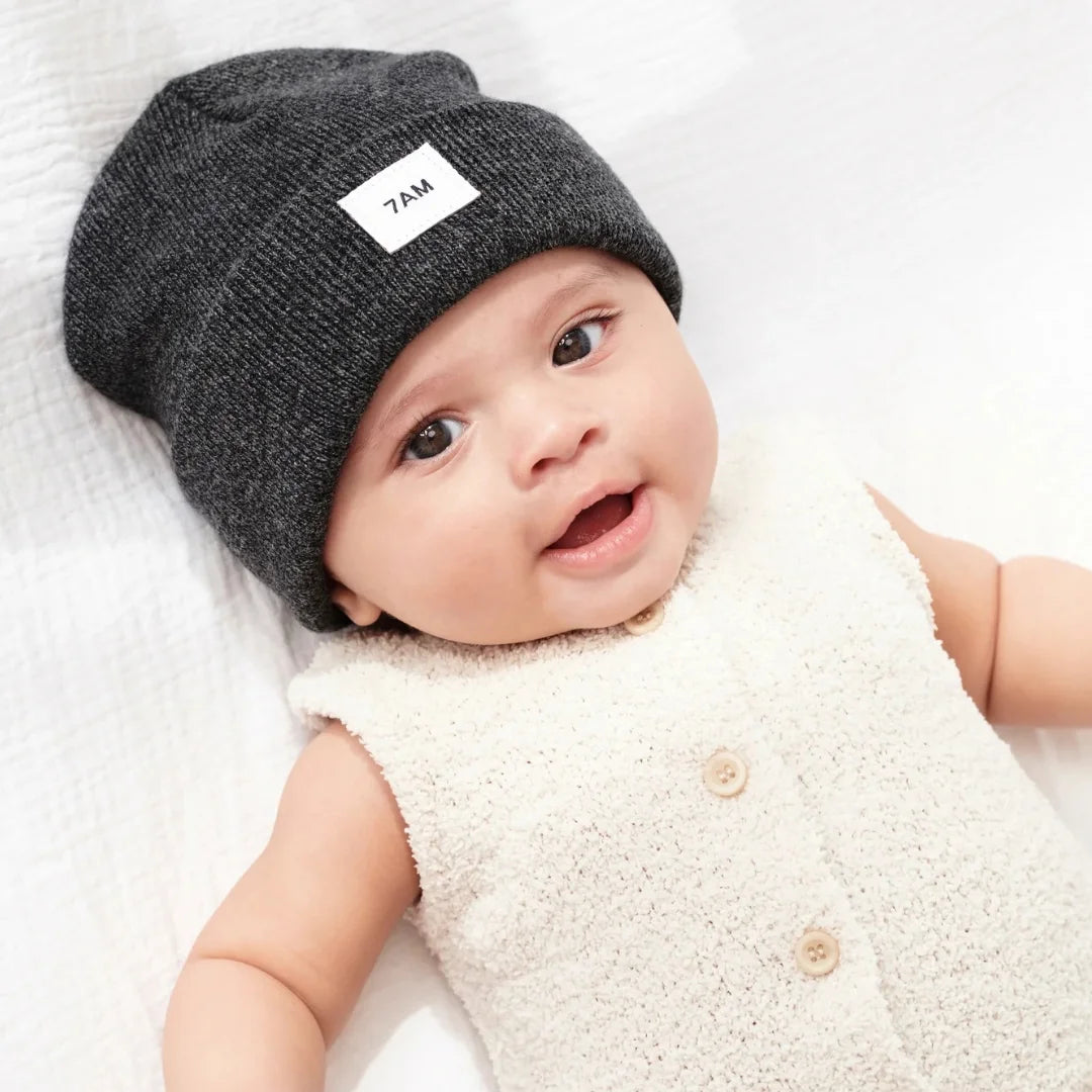 A child wearing the 7AM Enfant beanie comfortably
