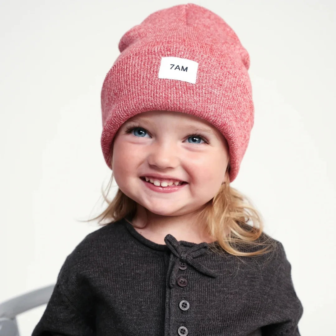 A child wearing the 7AM Enfant beanie comfortably 
