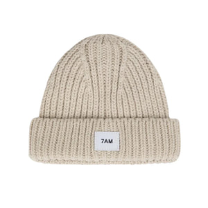 A flat-lay view of the 7AM Enfant chunky beanie in sand.
