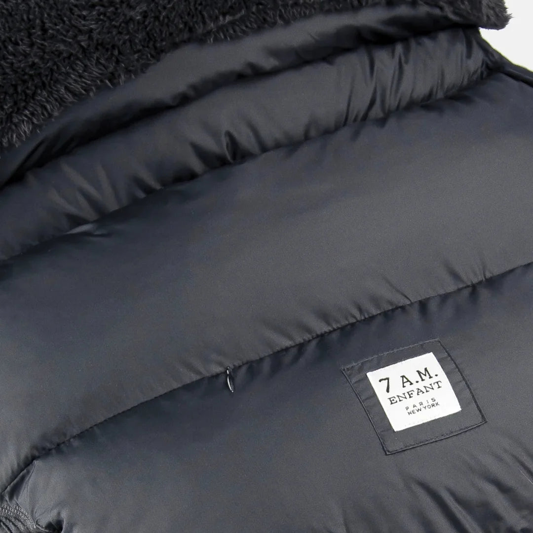 A high-resolution close-up of the plush fleece lining and harness slots.
