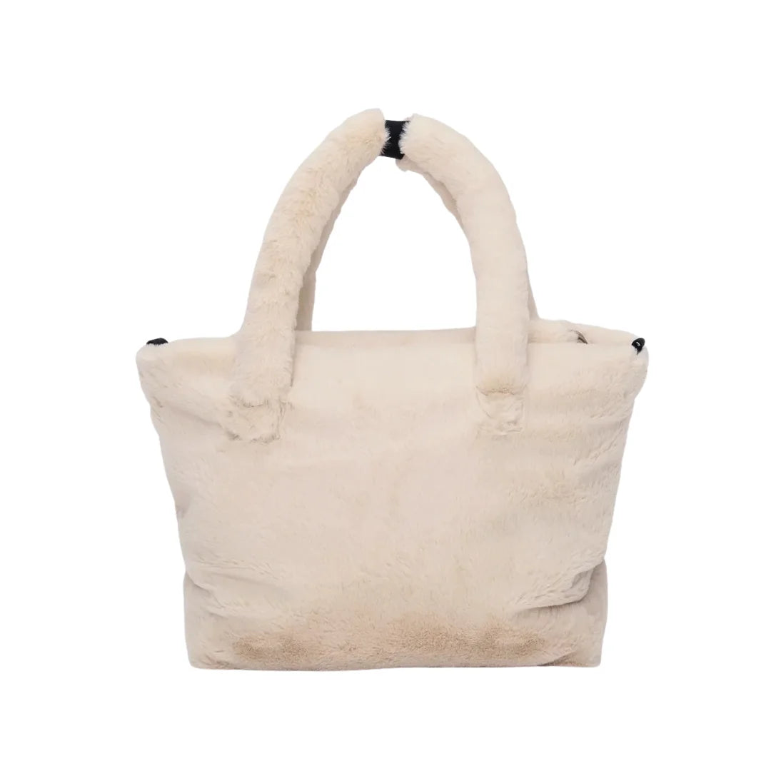 A flat-lay view of the 7AM Enfant stroller organizer in arctic white faux fur.