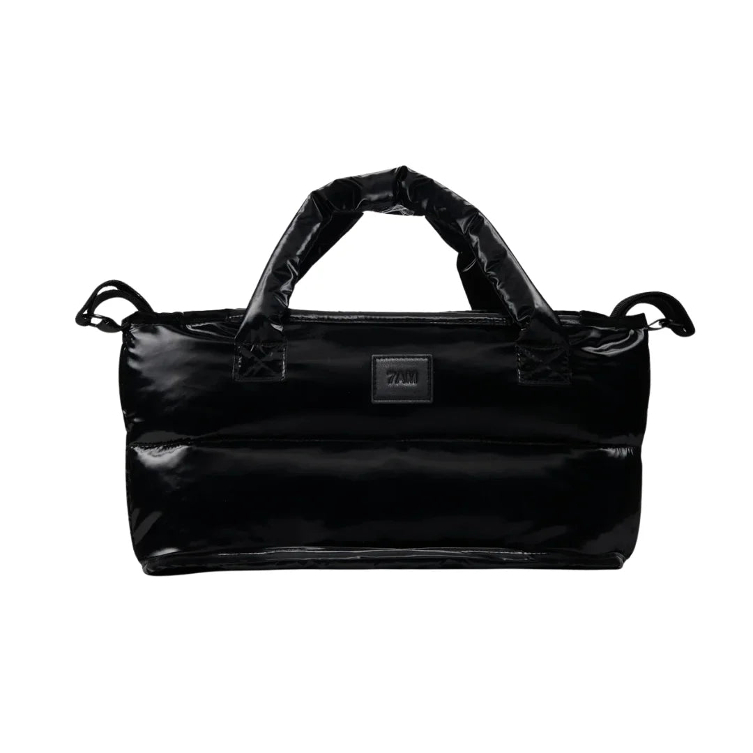A flat-lay view of the 7AM Enfant stroller organizer in black liquid shine.