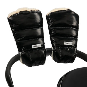 A flat-lay view of the 7AM Enfant Warmmuffs 212 in black liquid shine and arctic white faux fur.