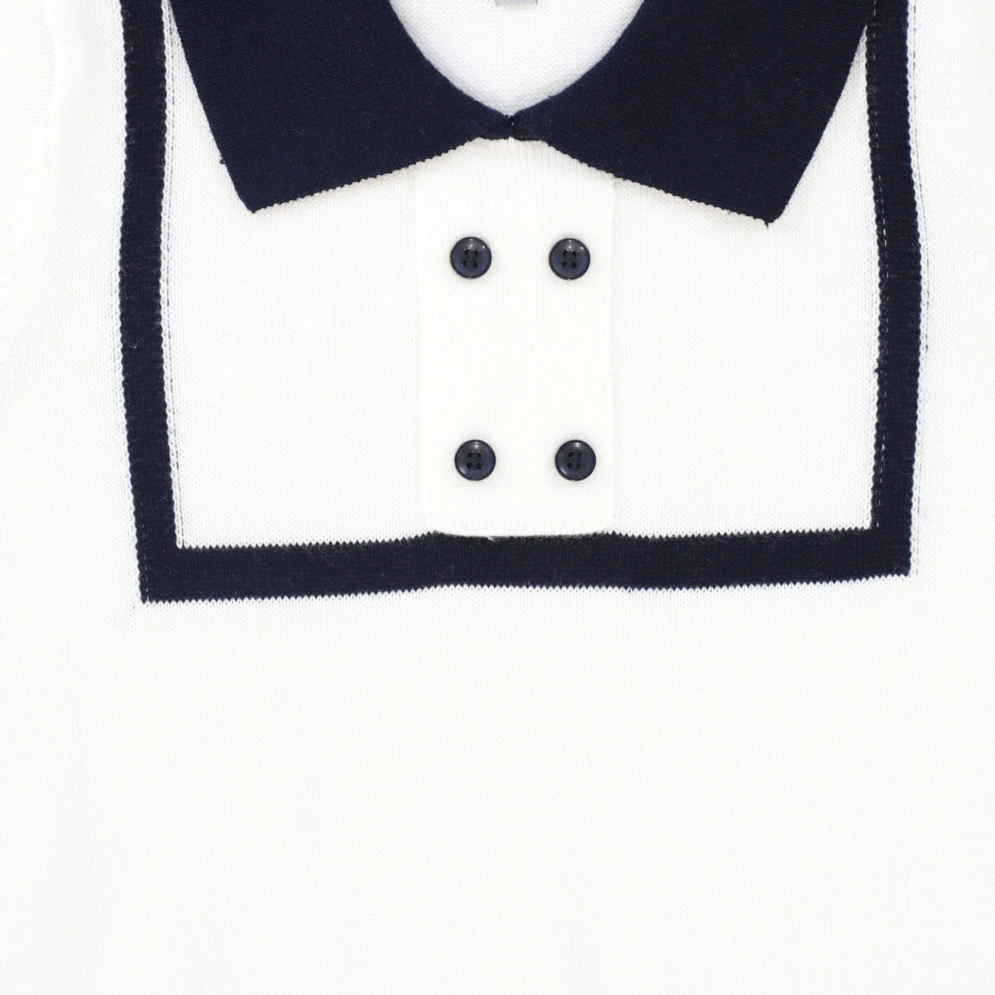 Close-up of a black and white collar with buttons on a white background