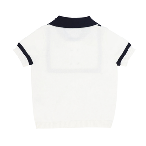 White polo shirt with black trim on a white background