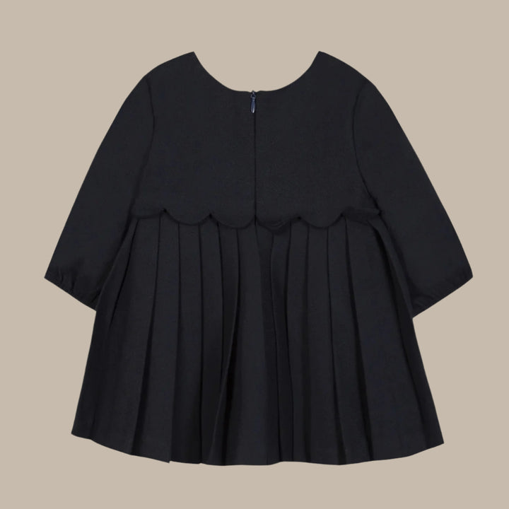 Black dress with ruffled sleeves on a white background