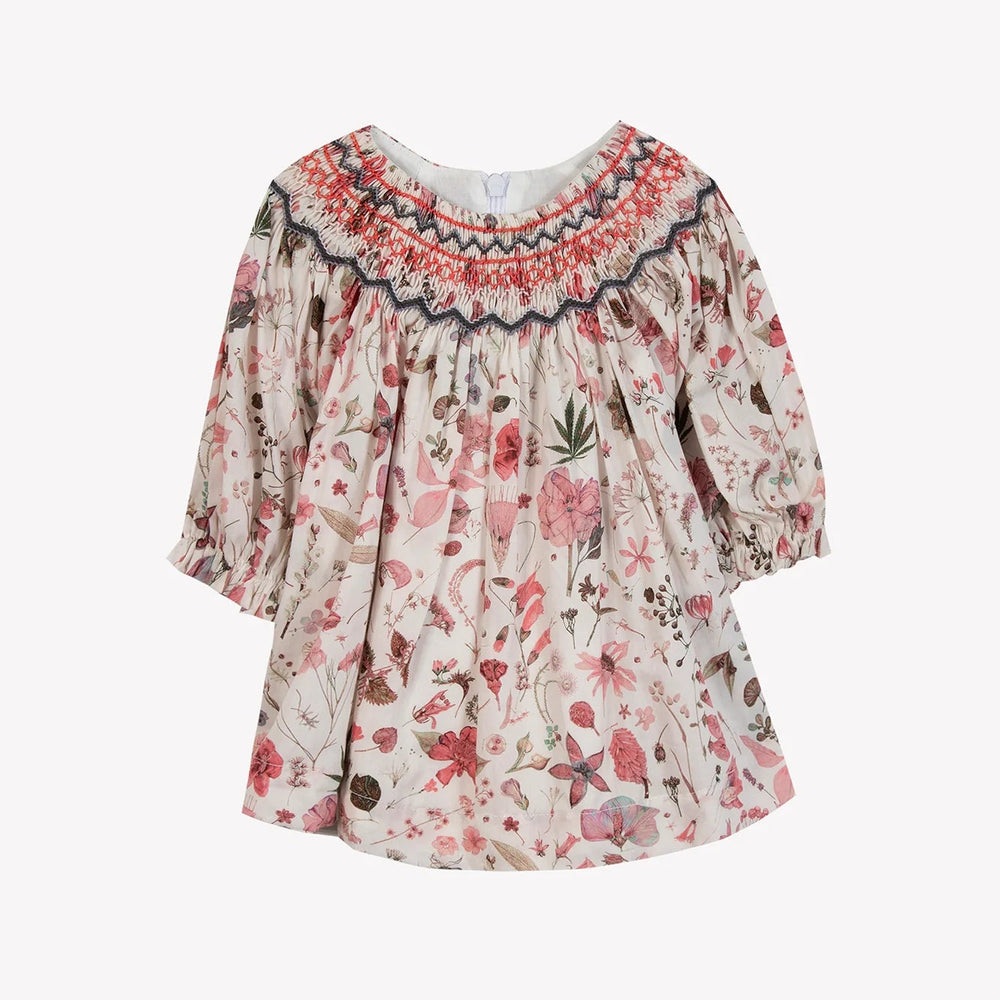 Floral dress with long sleeves on a white background