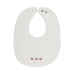 White baby bib with a small design on a white background