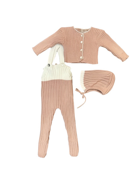 Baby outfit set with pink cardigan, white bib, and matching pants on a white background
