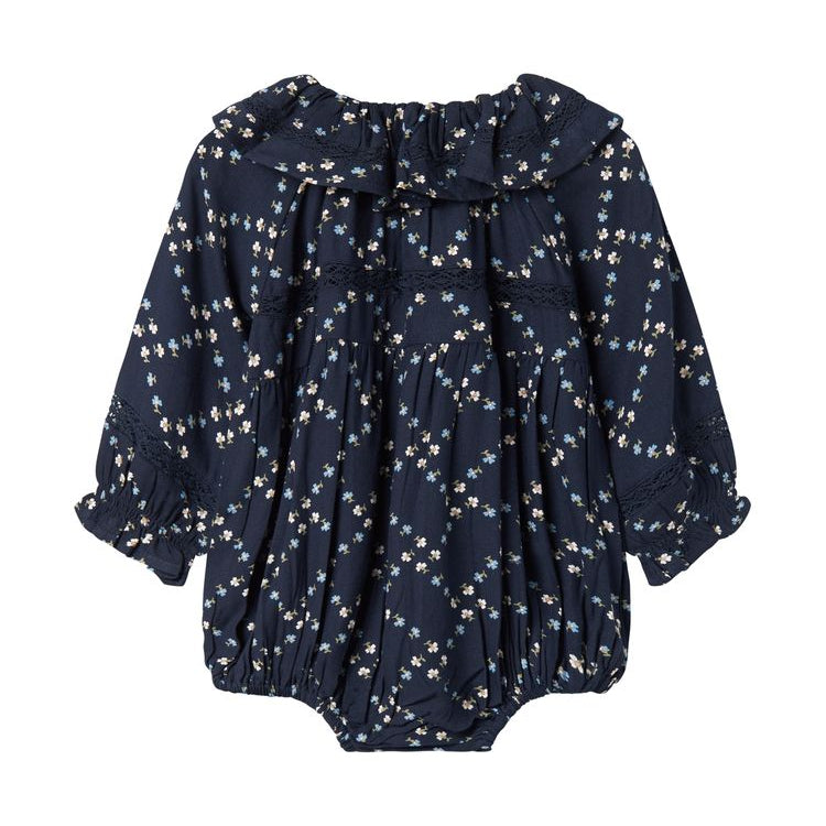 Navy blue baby romper with floral pattern on a white background