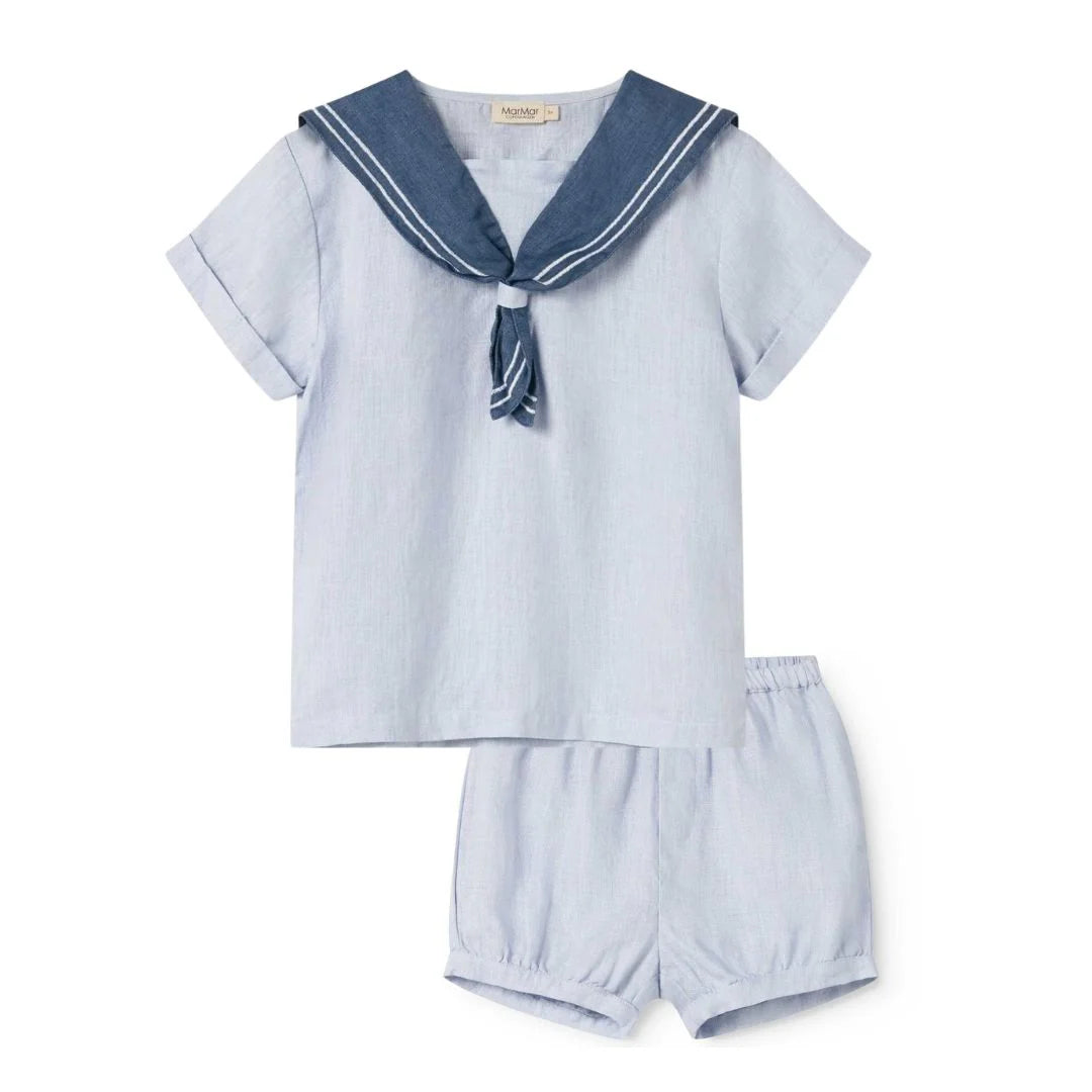 Children's nautical outfit with a shirt and shorts on a white background