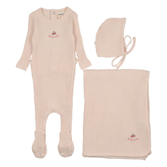 Baby outfit set with pink romper, bonnet, and blanket on a white background