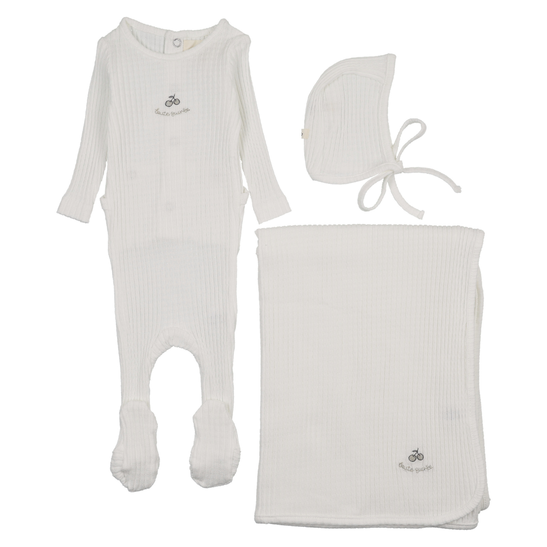 Baby clothing set with onesie, bonnet, and blanket on a white background