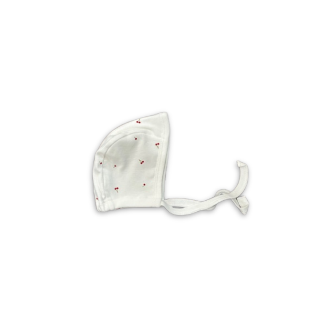 Cotton Pompom Mini Cherries baby bonnet in soft cotton, lightweight newborn hat with mini cherry print design