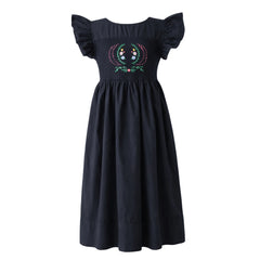 Black dress with floral embroidery on a white background