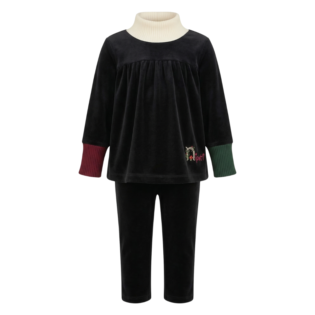 Black velvet outfit with a white turtleneck on a white background
