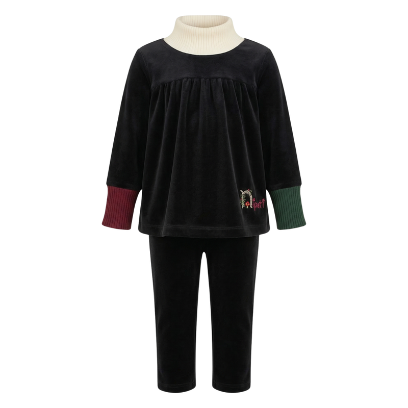Black velvet outfit with a white turtleneck on a white background