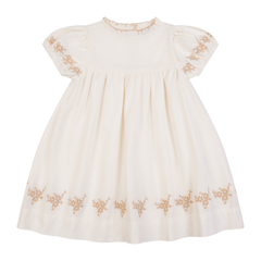 White dress with gold embroidery on a white background
