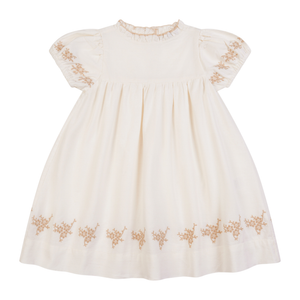 White dress with gold embroidery on a white background