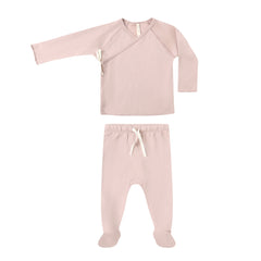 Pink baby outfit with top and pants on a white background