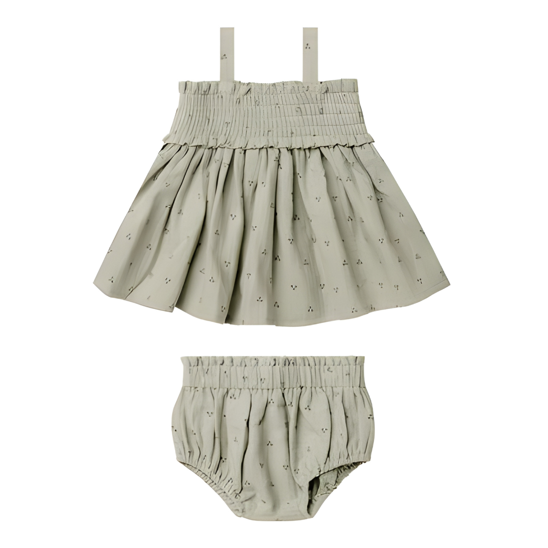 Children's skirt and bloomers set with a subtle pattern on a white background