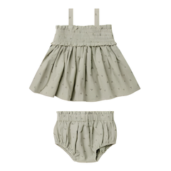 Children's skirt and bloomers set with a subtle pattern on a white background