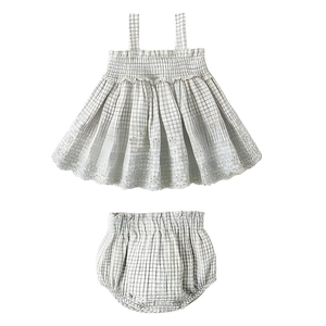 Checkered baby dress and bloomers set on a white background