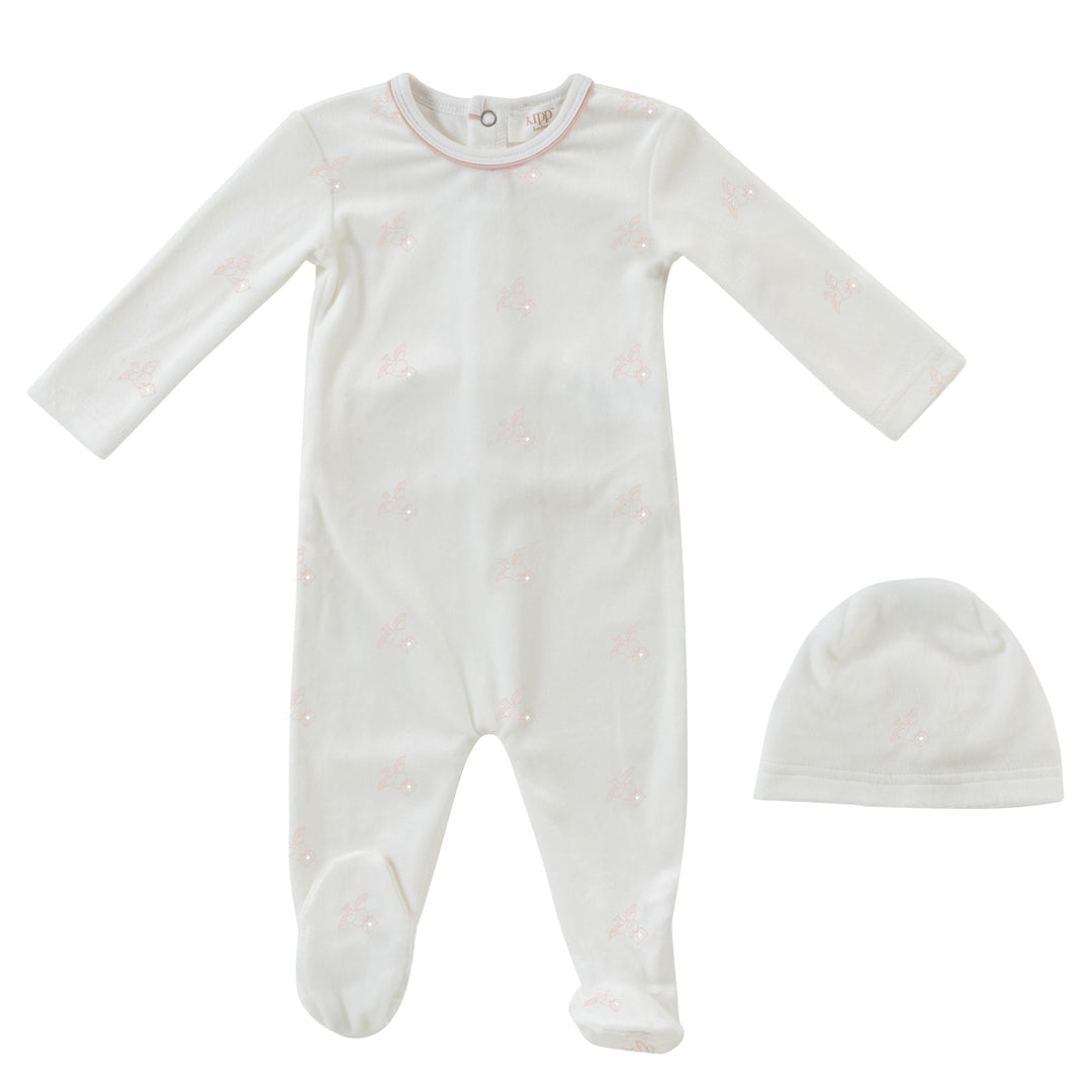 Baby onesie and hat set on a white background