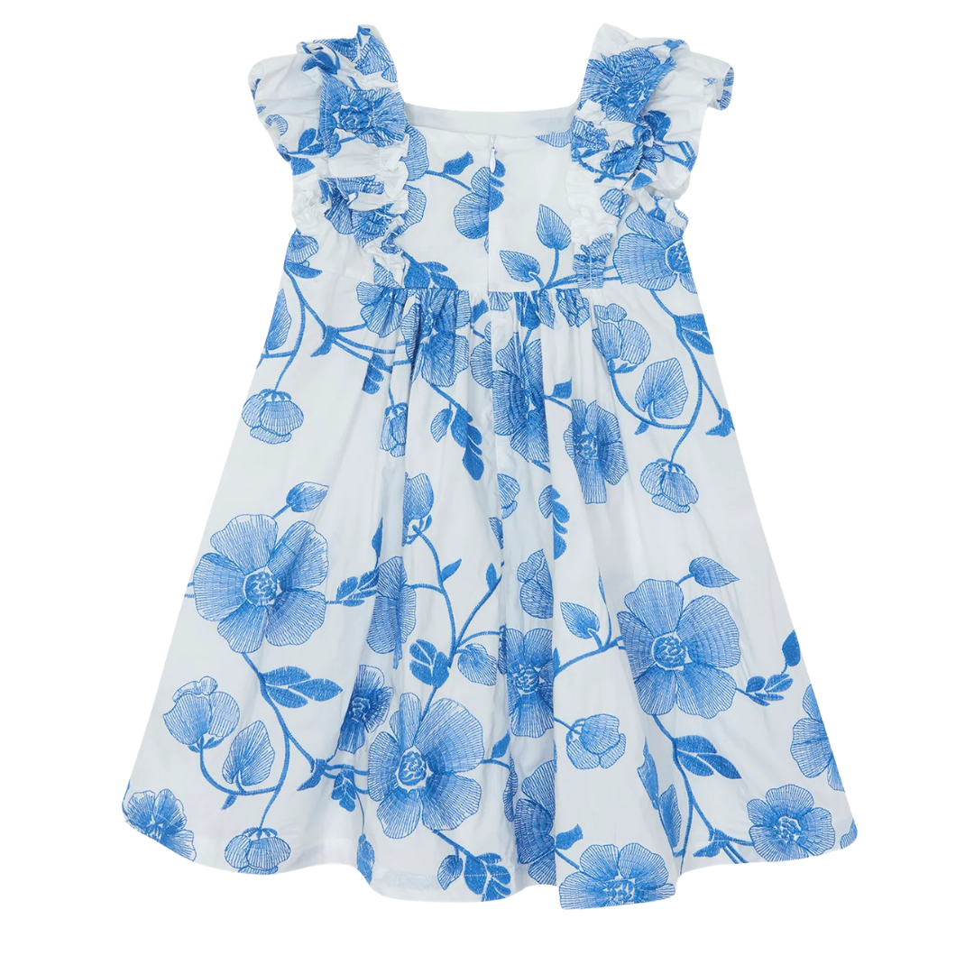 White dress with blue floral pattern on a white background