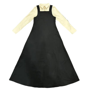 Black apron over a yellow shirt on a white background