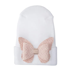A front view of the Adora fuzzy butterfly newborn hospital hat cream