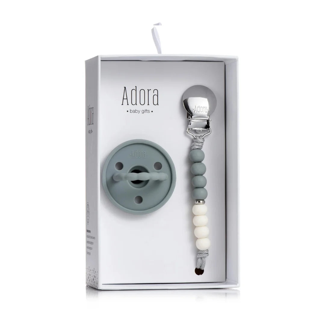 A flat-lay view of the Adora graphite ombre baby gift set items.