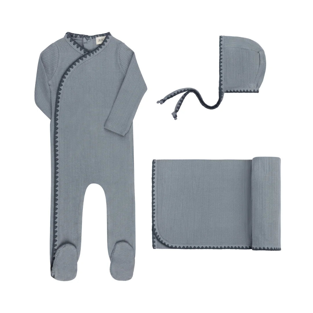 A front view of the Aurora blue whipstitch take me home newborn set.