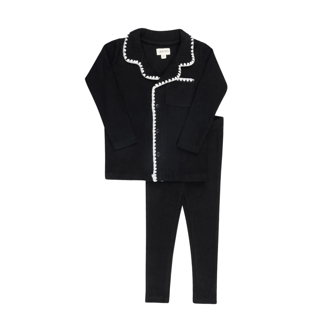 A front view of the Aurora black whipstitch pajama set for children.