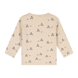 A long-sleeve baby t-shirt in cream heather with a small repeating pattern of teddy bears and blocks, shown from the back on a white background.