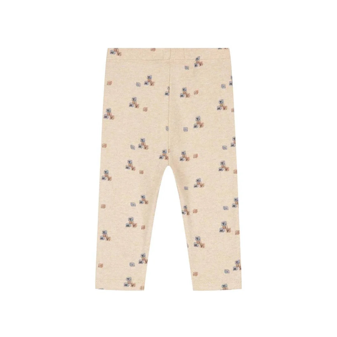 Beige baby leggings with a small teddy bear and block print pattern, shown flat against a white background.