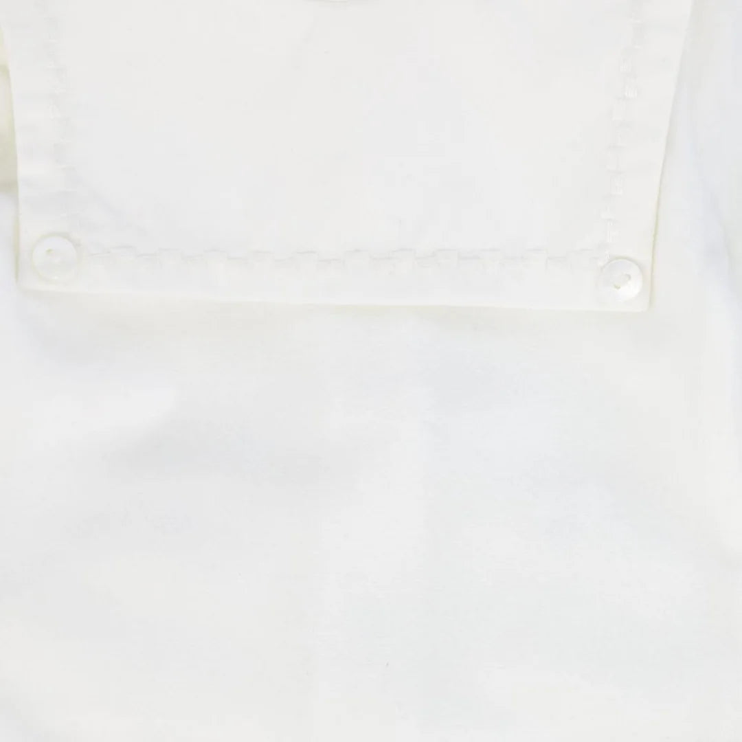 A high-resolution close-up of the plush velour texture and fine collar stitching.