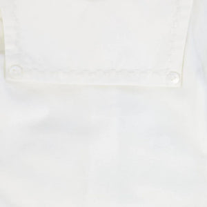 A high-resolution close-up of the plush velour texture and fine collar stitching.