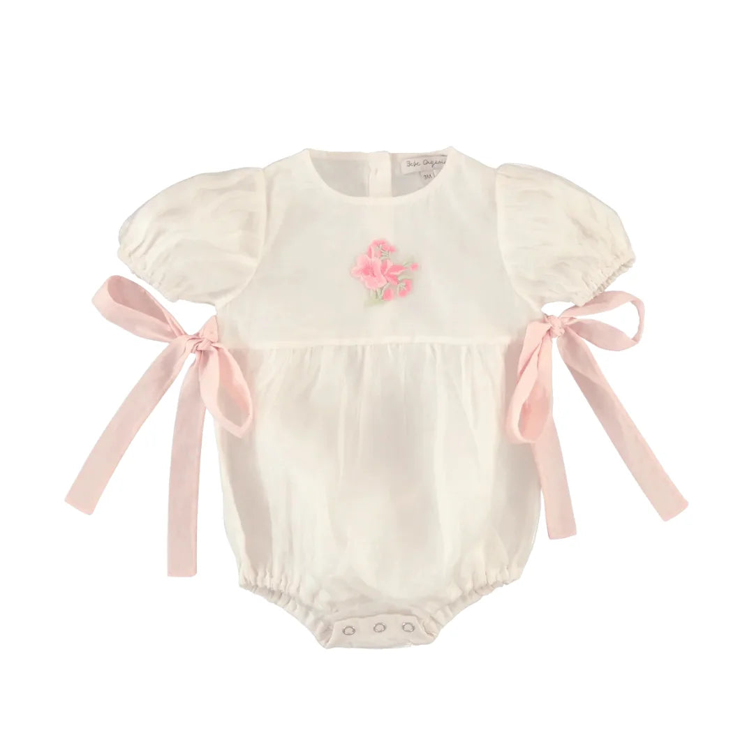 A front view of the soft rose-colored Bebe Organic Fairy romper for babies.