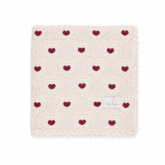 A neatly folded presentation showcasing the heart knit pattern and texture.