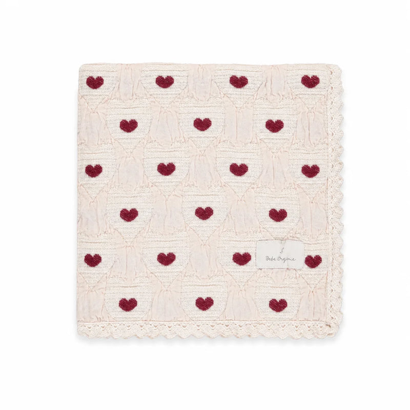 A neatly folded presentation showcasing the heart knit pattern and texture.