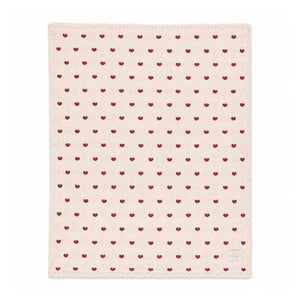 A front view of the Bebe Organic heart motif organic cotton baby blanket.